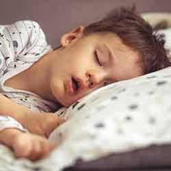 Child sleeping in bed