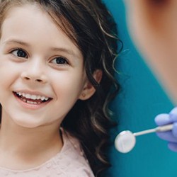 Child smiling for her dentist