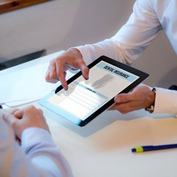 Dentist reviewing patient’s dental insurance